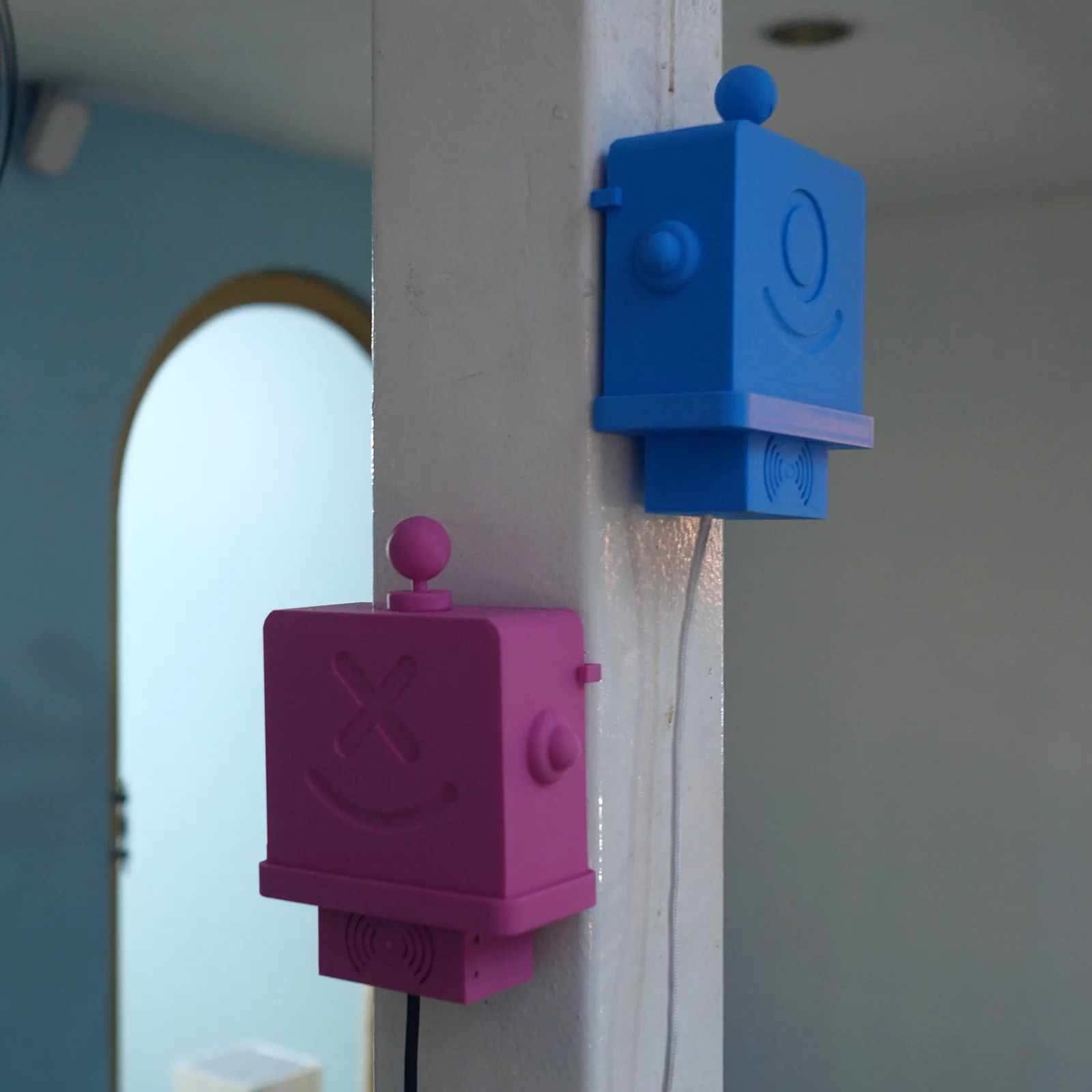 A magenta and a blue Altruist on two columns of the same walkway